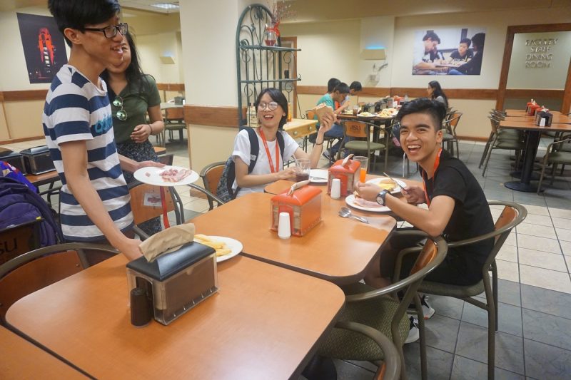Campers enjoying meals on campus