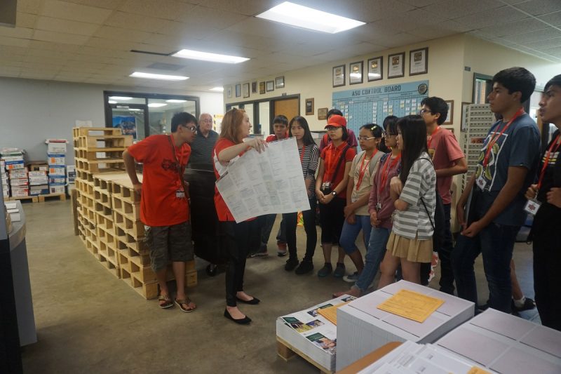 Campers listening to an introduction of the school's programs